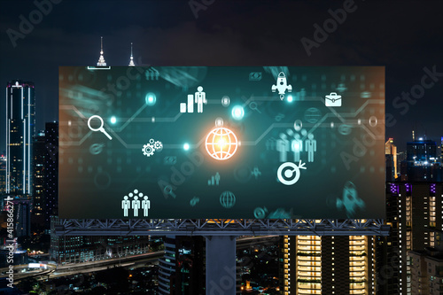 Research and technological development glowing icons on billboard. Night panoramic city view of Kuala Lumpur. Concept of innovative activities expanding new services or products in Malaysia, Asia.