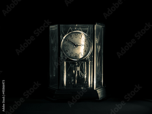 old clock on black background