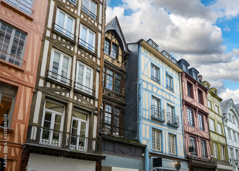 Half timbered homes line the Rue du Gros Horloge, the main street in the Normandy town of Rouen France