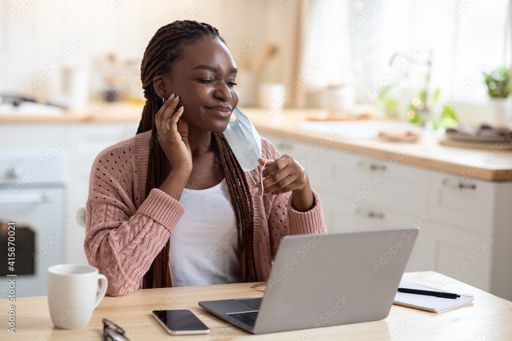Portrait Of Young Black Woman Scratching Face After Wearing Medical Mask Portrait Of Young Black Woman Scratching Face After Wearing Medical Mask