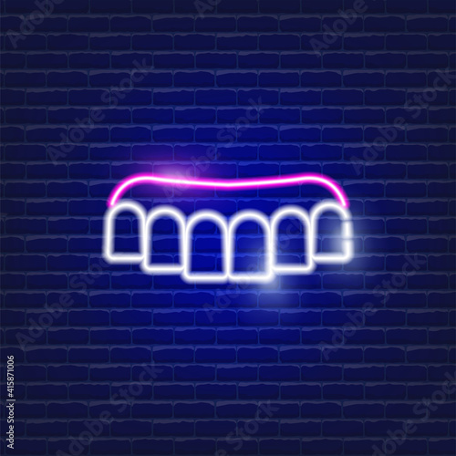 Removable dentures neon icon. Sign for dentistry clinic. Orthodontics concept.