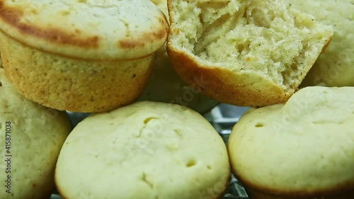 closeup zoom in at many delicious white wholes and broken muffins with coconut