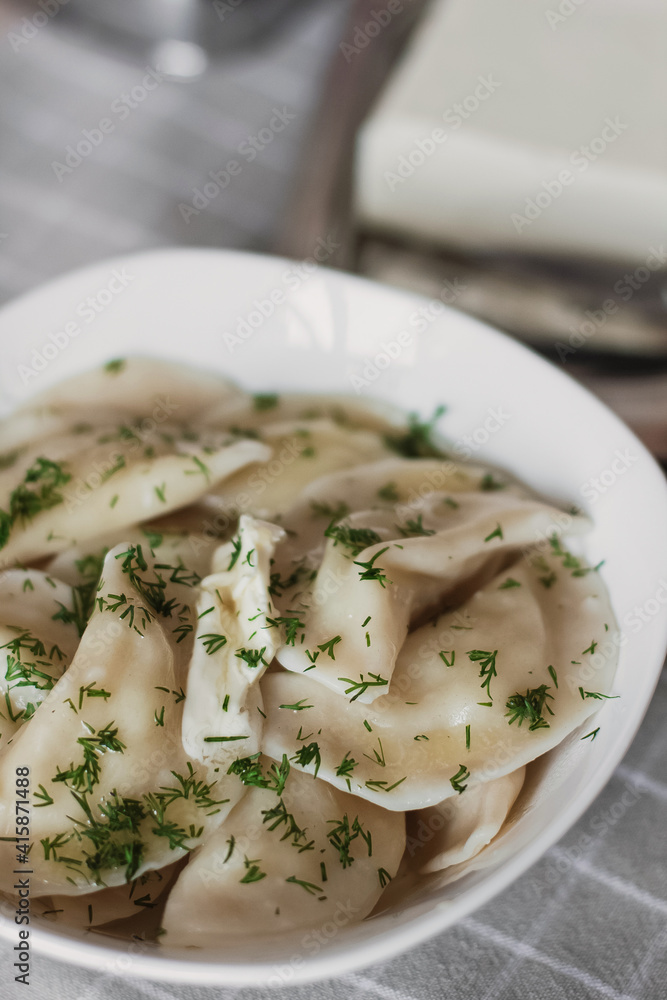 Dumplings, filled with potatoes and served with butter and fennel. Varenyky, vareniki, pierogi, pyrohy. Dumplings with filling. Dumplings, filled with potatoes and served with butter and fennel. Varenyky, vareniki, pierogi, pyrohy. Dumplings with filling.