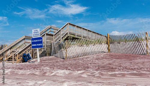 Wooden staircase for walkway over the sand dunes on a Fire Islands Beach photo