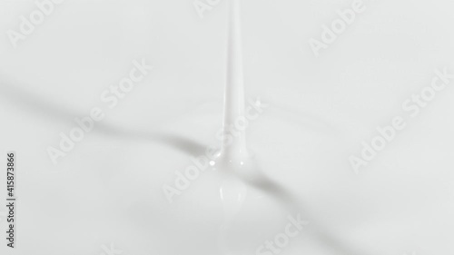 Super Slow Motion Detail Shot of Fresh Milk Drop at 1000 fps. photo