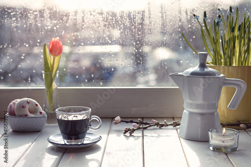 Fotografie Oriental coffee in traditional copper coffee pot with flowers on window sill