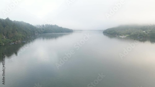 Beautiful River rapids in the fog in the morning. River water landscape. Flying from the drone through the morning fog over the river. Beautiful landscape. Forest river flow
