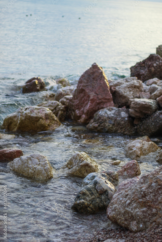 stone beach in the rock. Black Sea. sunset. stone beach in the rock. Black Sea. sunset.