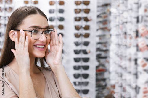 Portrait of young lady wearing spectacles in store
