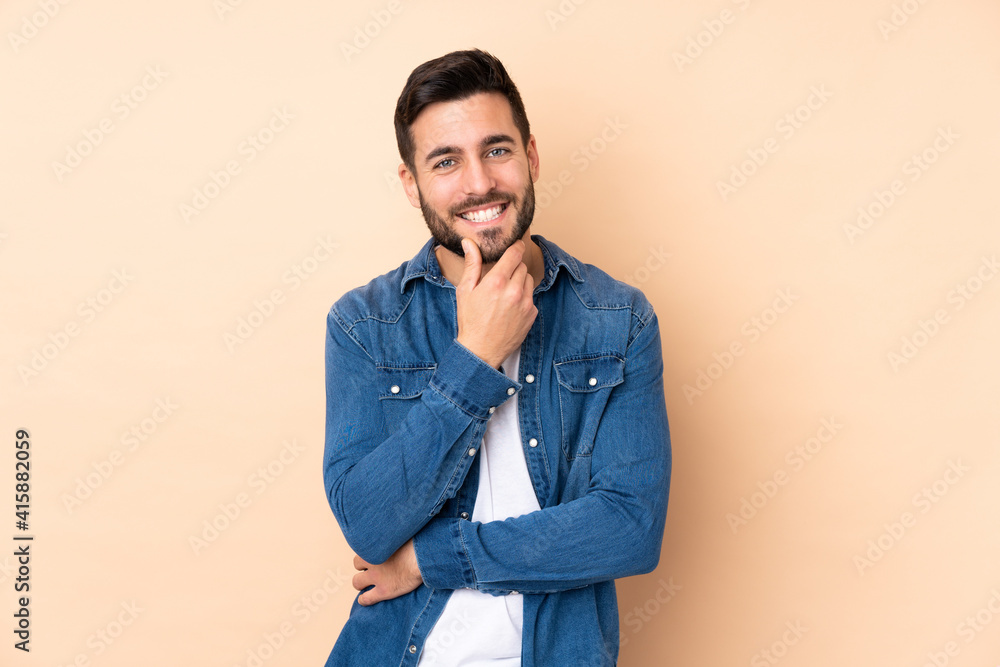 Caucasian handsome man isolated on beige background happy and smiling Caucasian handsome man isolated on beige background happy and smiling