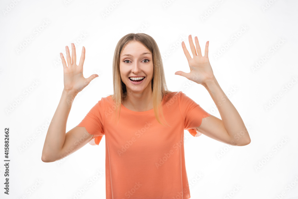 Surprised and happy blond girl express overjoy and surprised, spread hands sideways and smiling, hear amazing info Surprised and happy blond girl express overjoy and surprised, spread hands sideways and smiling, hear amazing info