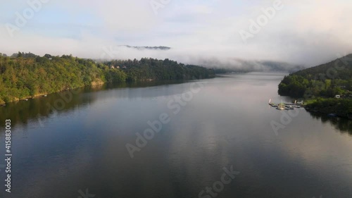 Beautiful River rapids in the fog in the morning. River water landscape. Flying from the drone through the morning fog over the river. Beautiful landscape. Forest river flow