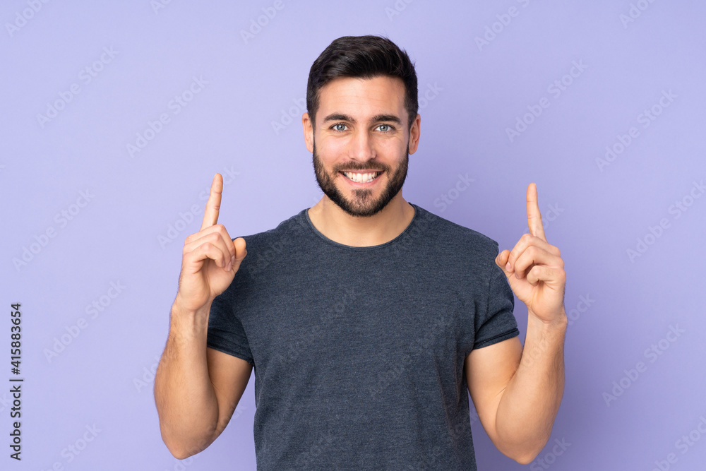 Caucasian handsome man pointing up a great idea over isolated purple background Caucasian handsome man pointing up a great idea over isolated purple background