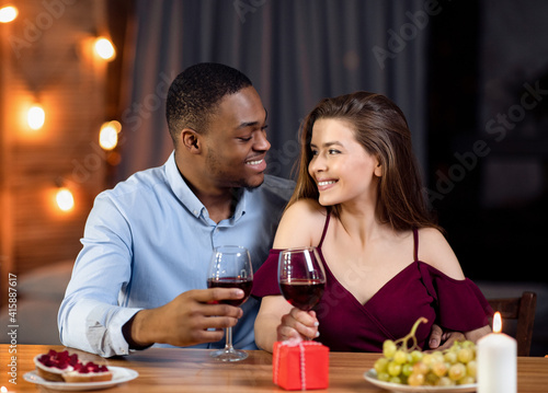 Affectionate Multicultural Couple Enjoying Date In Restaurant  Celebrating Valentine s Day Together