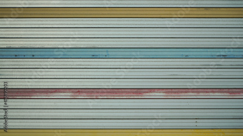 Aluminum roller shutter door in a closed garage close up pattern texture
