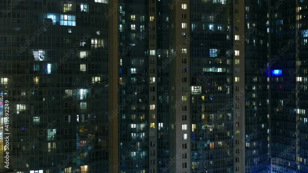 crowded life, evening windows in a residential building panorama time lapse crowded life, evening windows in a residential building panorama time lapse