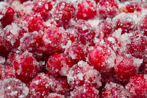 Fresh cherries are sprinkled with sugar. Sugar crystals on cherries. Preparation for making natural fresh cherry jam.