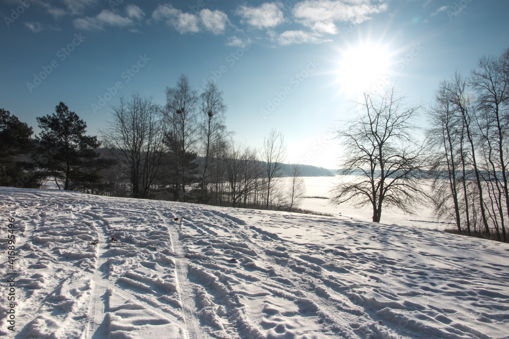 ice shell on a lake covered with snow on a sunny winter day as a background ice shell on a lake covered with snow on a sunny winter day as a background