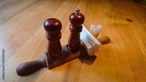 Wooden salt and pepper shakers on the table