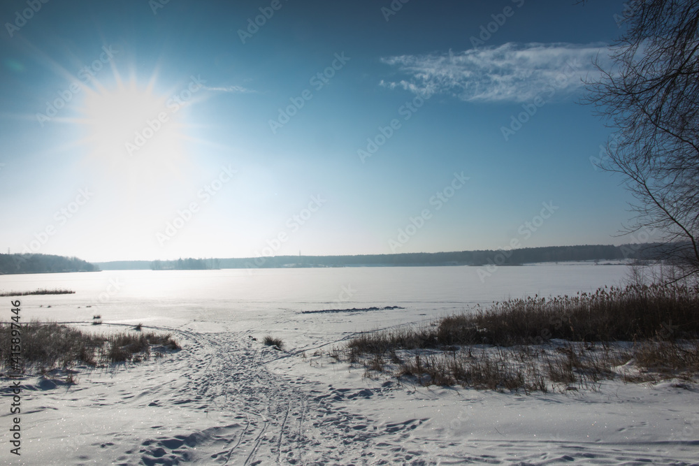 ice shell on a lake covered with snow on a sunny winter day as a background ice shell on a lake covered with snow on a sunny winter day as a background