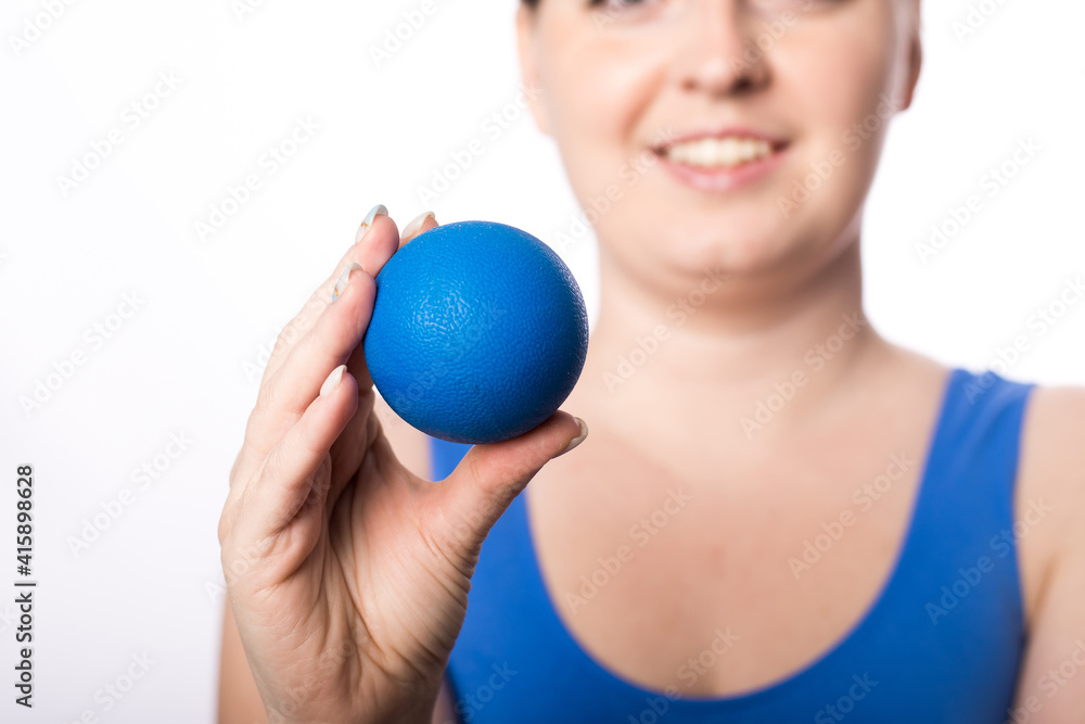 A girl with a smile holds a ball for myofascial points in her hand. healthy lifestyle.
Suitable for sports massage roller. White background. place for text. close-up A girl with a smile holds a ball for myofascial points in her hand. healthy lifestyle.
Suitable for sports massage roller. White background. place for text. close-up