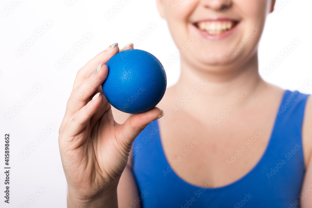 A girl with a smile holds a ball for myofascial points in her hand. healthy lifestyle.
Suitable for sports massage roller. White background. place for text. close-up A girl with a smile holds a ball for myofascial points in her hand. healthy lifestyle.
Suitable for sports massage roller. White background. place for text. close-up