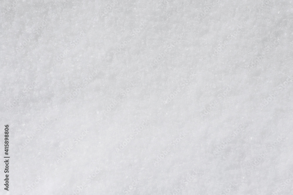 Background, texture of winter white fresh snow. Photo, top view.