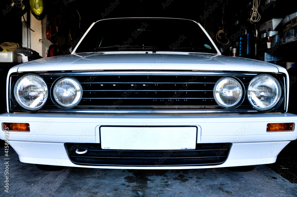 up close view  of white car in a garage