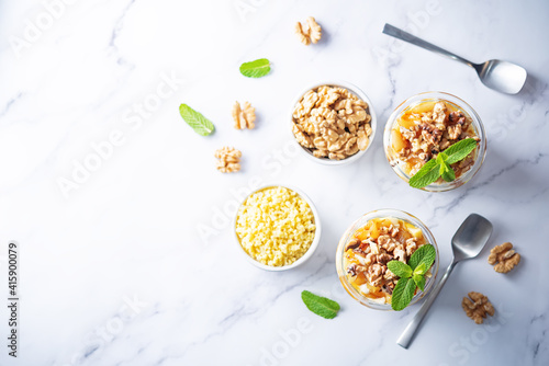 Wallpaper Mural Greek yogurt millet caramelized apple walnuts parfait in a glass Torontodigital.ca