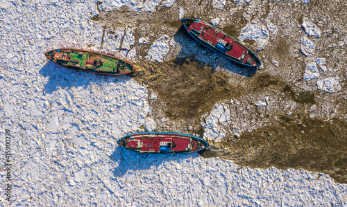 Icebreaker ships crushing ice on Vistula river, Plock, 2021-02-21, Poland photo