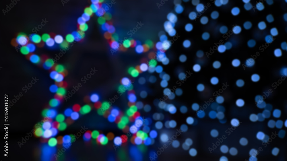 multicolored festive bokeh out of focus in the shape of a star, suitable for text in the foreground multicolored festive bokeh out of focus in the shape of a star, suitable for text in the foreground