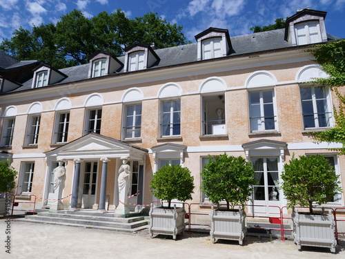 Fototapeta Naklejka Na Ścianę i Meble -  The facade of a beautiful house. A building located in a park   (name of the park: Vallée aux Loups) in the west of Paris. July 2020, France. Chatenay-Malabry city. 