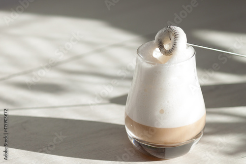 Milk foam maker. Mini blender, frothers for coffee, latte photo