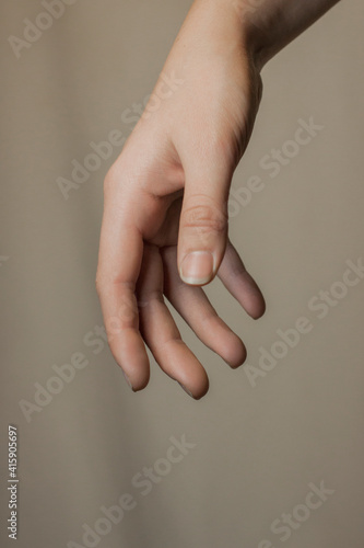 Close up of a hand asking for help. Raised hand.