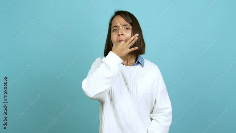 Young brunette woman doing time out gesture over isolated background Young brunette woman doing time out gesture over isolated background