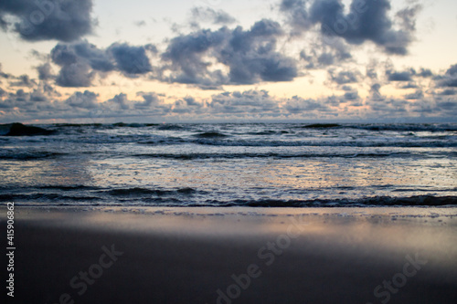 Evening seascape with clouds and waves.