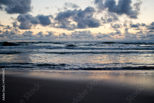 Evening seascape with clouds and waves. © HENADZI BUKA