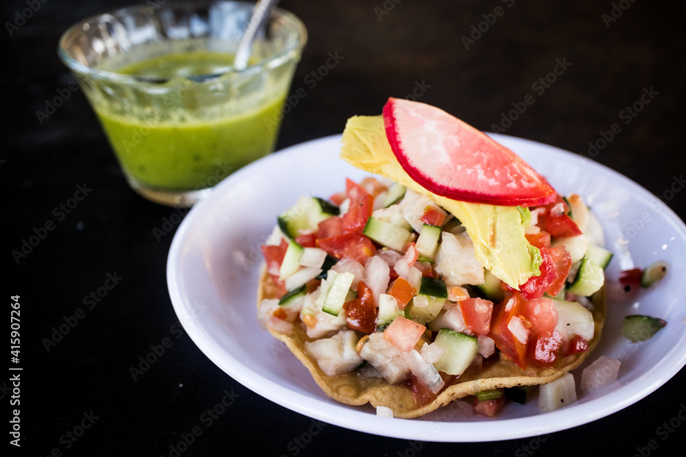 Fresh fish ceviche tostada served at a beach restaurant in the Riviera Nayarit in Mexico Fresh fish ceviche tostada served at a beach restaurant in the Riviera Nayarit in Mexico