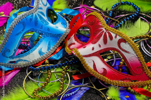 Red And Blue Carnival Masks With Feathers And Jewelry