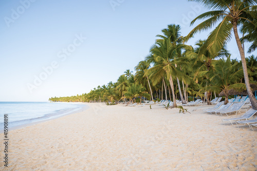 Fototapeta Naklejka Na Ścianę i Meble -  Tropical white sandy beach with palm trees. Saona Island, Dominican Republic. Vacation travel background.