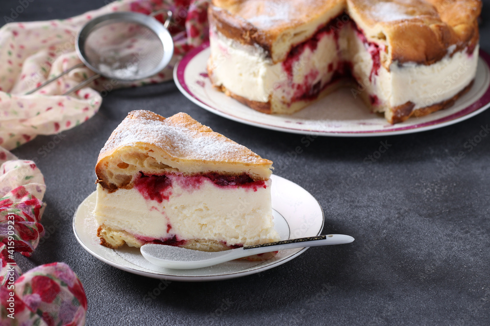 Karpatka with cherries, traditional Polish cream pie on dark gray background. Karpatka with cherries, traditional Polish cream pie on dark gray background.