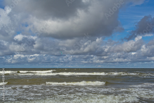 Beach during the day. Clouds and sea waves. © HENADZI BUKA
