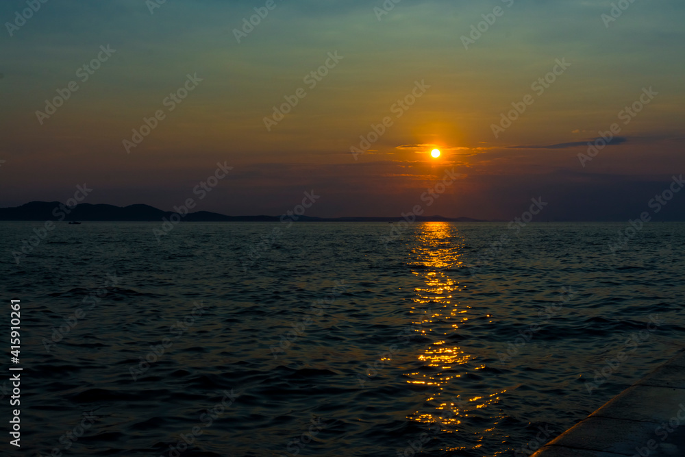 Sunset at the beach of Zadar city in Croatia