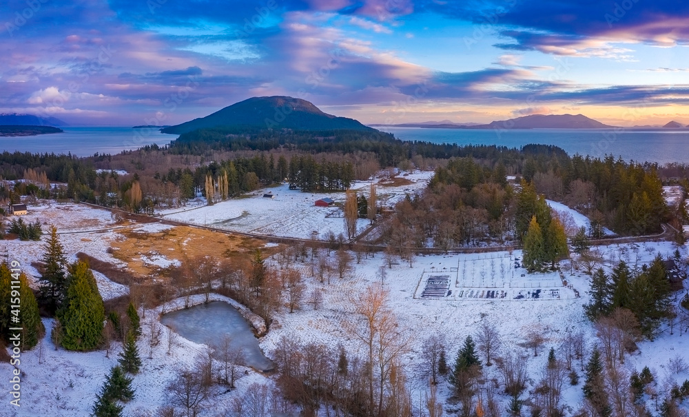 Snowfall on Lummi Island, Washington, During a Beautiful Sunset. Snow is rare in the San Juan