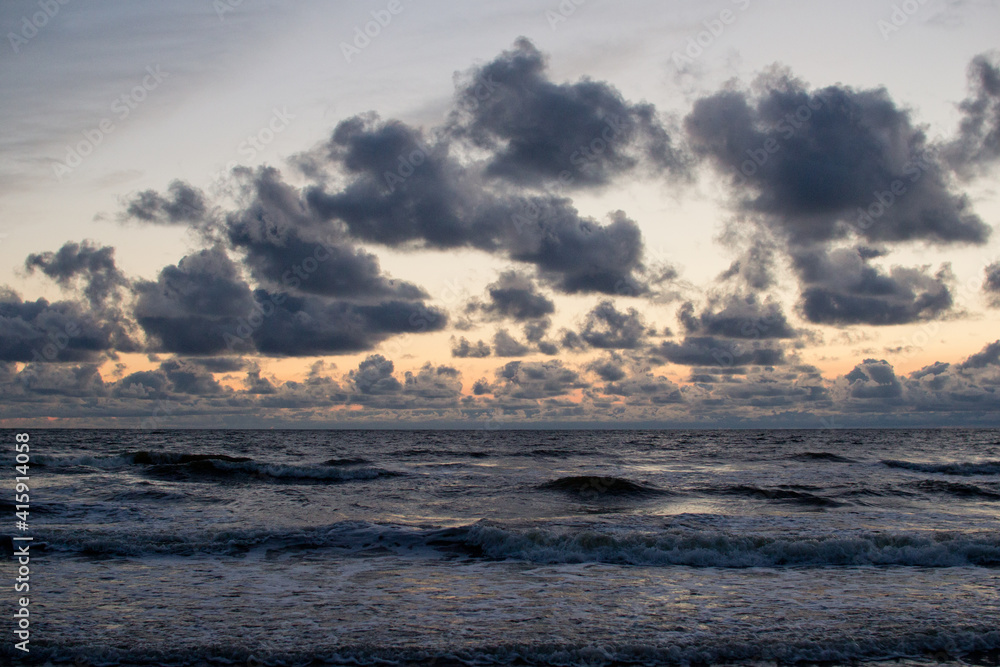 Evening seascape with clouds and waves. Evening seascape with clouds and waves.