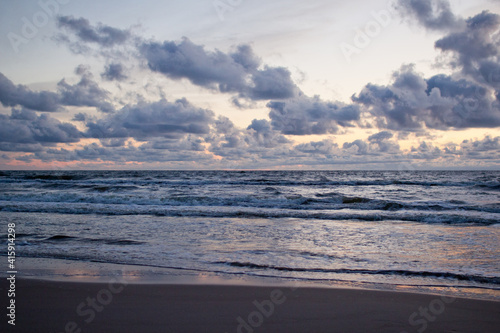 Evening seascape with clouds and waves. photo