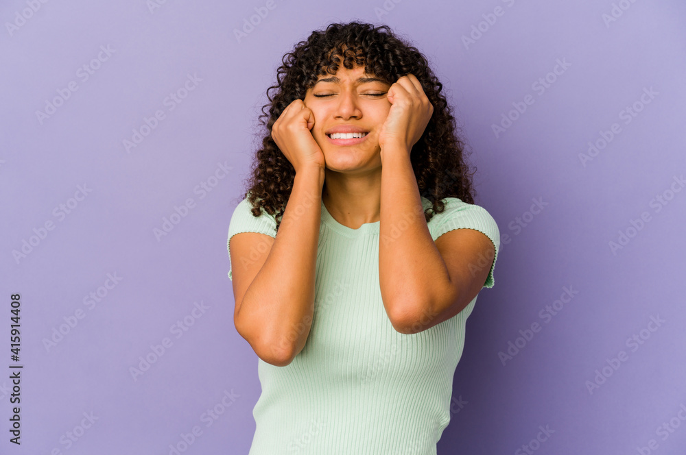 Young african american afro woman isolated crying, unhappy with something, agony and confusion concept. Young african american afro woman isolated crying, unhappy with something, agony and confusion concept.
