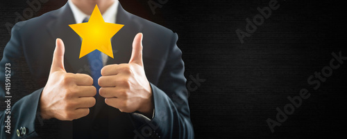 Business man show thumb up good job Success win.five stars, reward, Customer feedback, Recognition employee review.Good Comment First place competition stars. Business Success reviews from customer. photo