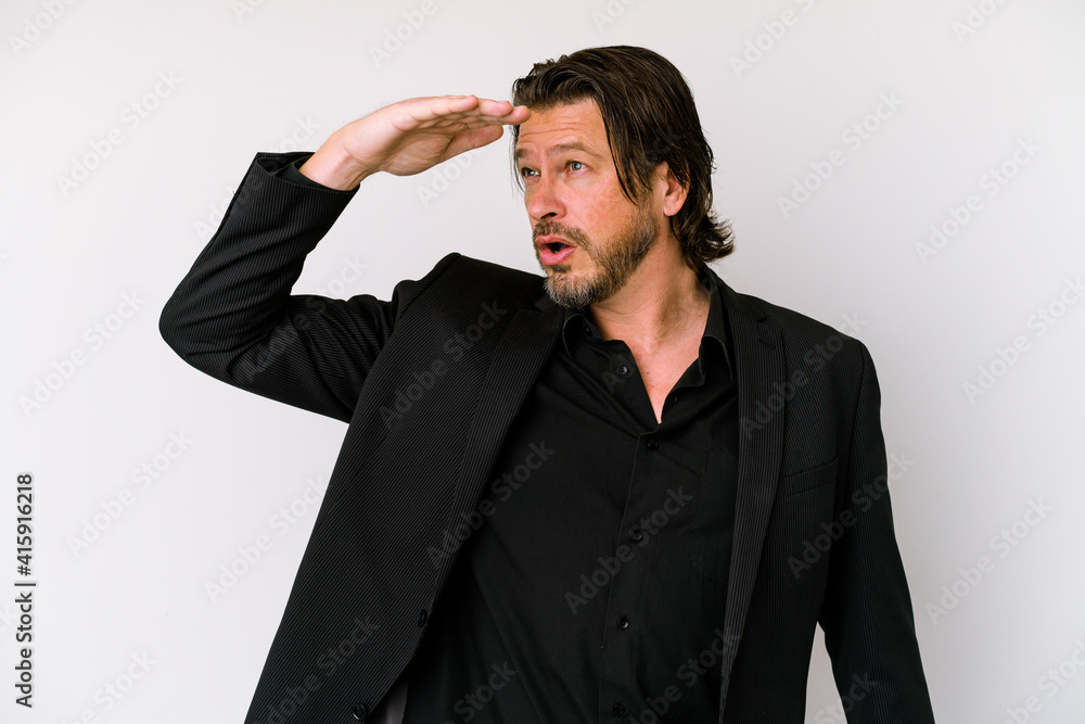 Middle age business dutch man isolated on white background looking far away keeping hand on forehead. Middle age business dutch man isolated on white background looking far away keeping hand on forehead.