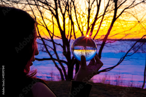 Tableau sur toile Spiritual Indian Woman seeing and watching a Crystal Lens Ball during a Colorful